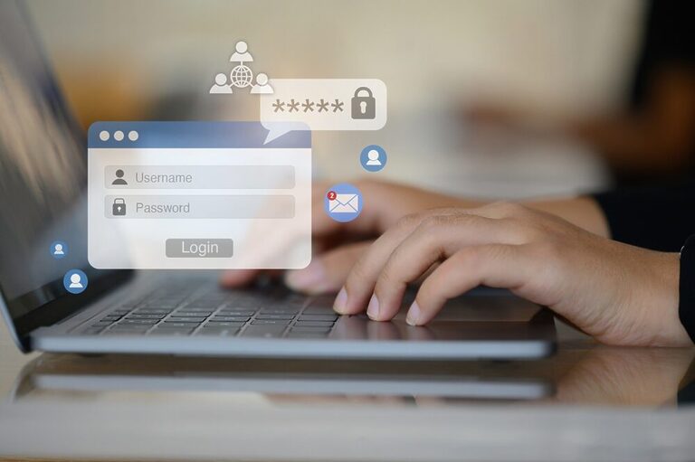 The image shows hands typing on a laptop and highlights login credentials and online privacy