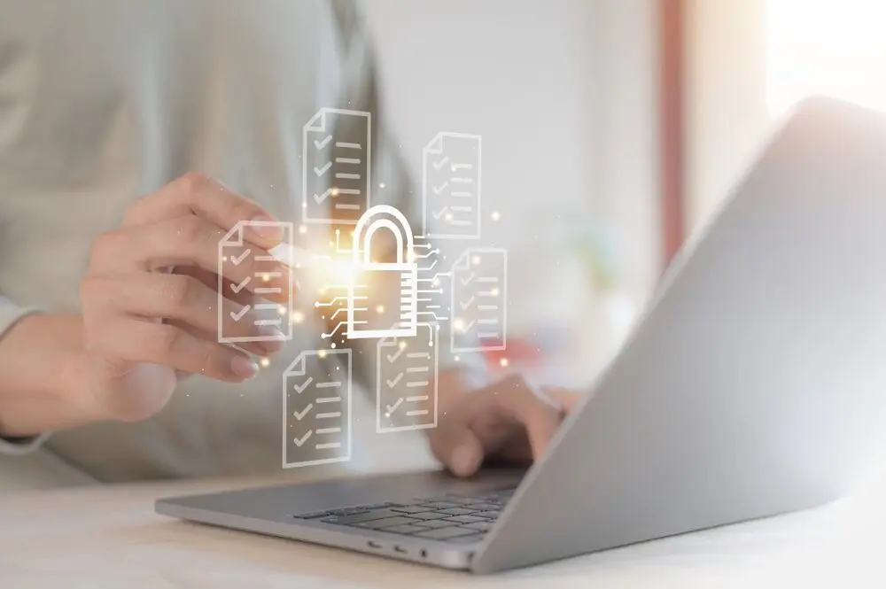 Digital illustration of a padlock in front of a real laptop, symbolizing online security and privacy.