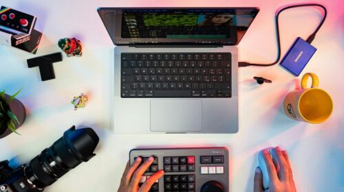 Person working on a laptop at home creating a creative business plan, exploring profitable online creative business and online side hustle ideas.