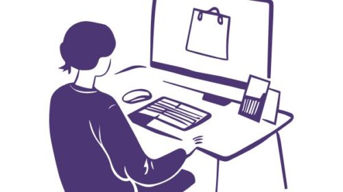 Illustration of a person sitting at a desk, setting up an online store on her computer, after learning how to create an ecommerce website.