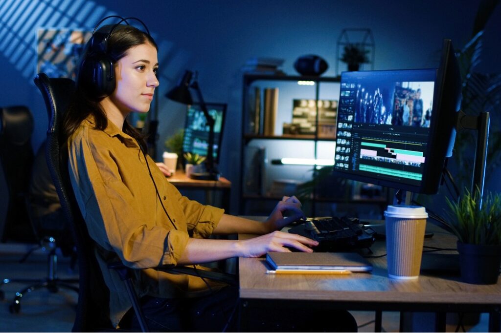 Young woman editing videos with Adobe Express.